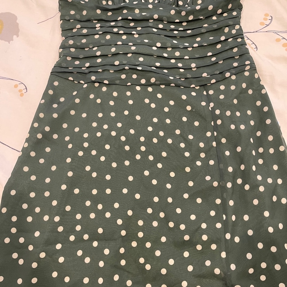 Green dress with lovely white point.